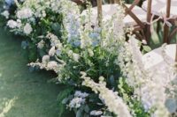 23 a dreamy wedding aisle accented with blue and white delphinium is a lovely and chic idea for a spring wedding