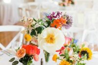 24 a bright cluster wedding centerpiece with peachy, red, pink, white, yellow blooms including allium is wow