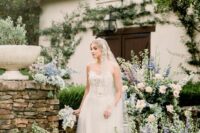 24 a pastel wedding altar of greenery, blush and blue blooms is a lovely idea for a garden wedding