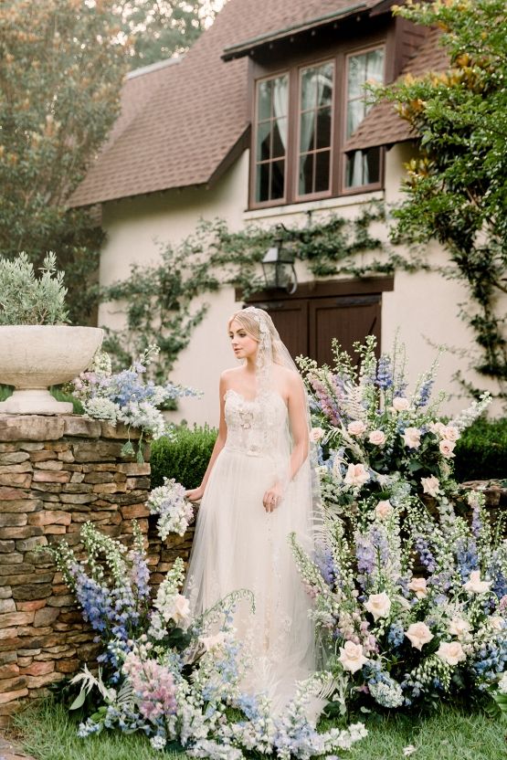 a pastel wedding altar of greenery, blush and blue blooms is a lovely idea for a garden wedding