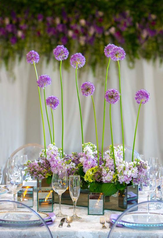 a chic yet very simple wedding centerpiece of a mirror box with blush and white hydrangeas and allium is a glam solution