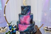 27 a galaxy-inspired wedding cake with hot pink detailing and gold constellations plus a half moon cake topper is wow