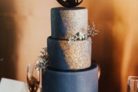 32 a navy and gold starry night wedding cake with a couple cake topper and some blooms is great for a romantic celestial wedding