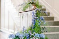 32 beautiful wedding staircase decor with greenery and thistles, lilac and blue blooms including delphinium is amazing