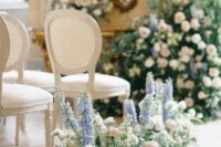 35 delicate wedding aisle decor with greeneyr, white roses and ranunculus and blue delphinium is a chic and lovely idea