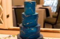 39 a starry night wedding cake with a gorgeous topper and a bit of gold leaf all over the cake is a gorgeous idea for a wedding