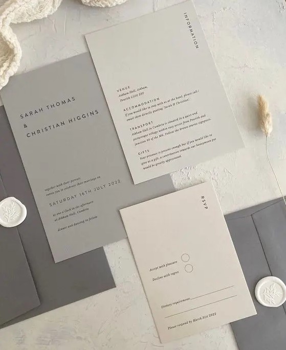 a chic minimalist wedding invitation suite in shades of grey and tan, with black lettering is a cool idea for a minimalist wedding