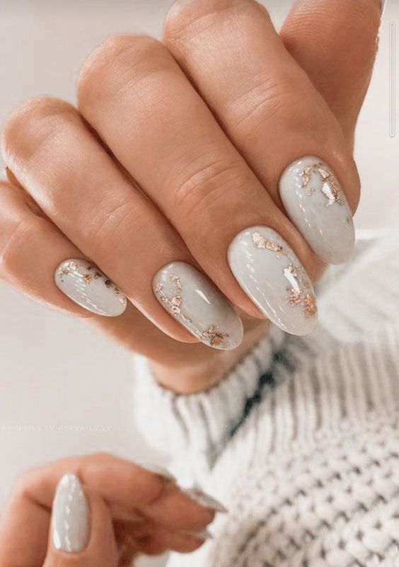 a stylish and timeless grey and gold foil nail design will match many bridal looks and styles