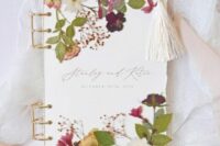 04 a fantastic pressed flower wedding guest book with gold touches is a very sophisticated idea