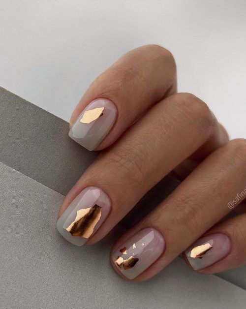 gorgeous neutral wedding nails accented with gold foil will add a touch of glam to your look