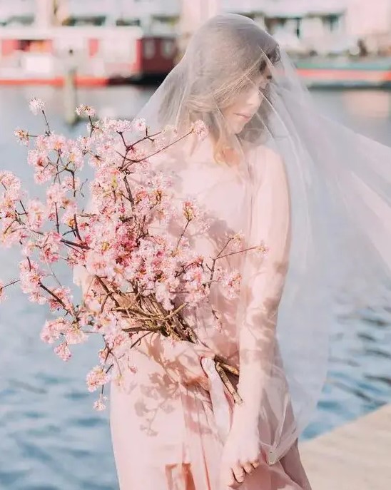 a dreamy and beautiful pink cherry blossom wedding bouquet is a truly spring-like idea with a bit of delicate color