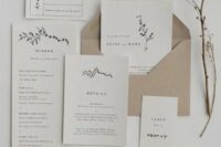 07 a minimalist wedding invitation suite in neutrals and with a kraft paper envelope, with black lettering and a bit of botanical prints