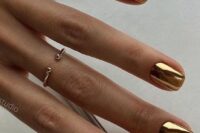 07 shiny glam gold wedding nails will be a perfect idea for a modern or minimalist bride who wants to add a shiny touch to the look