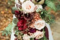 09 a jaw-dropping woodland wedding bouquet with blush and purple blooms, with foliage, fern and twigs is all cool
