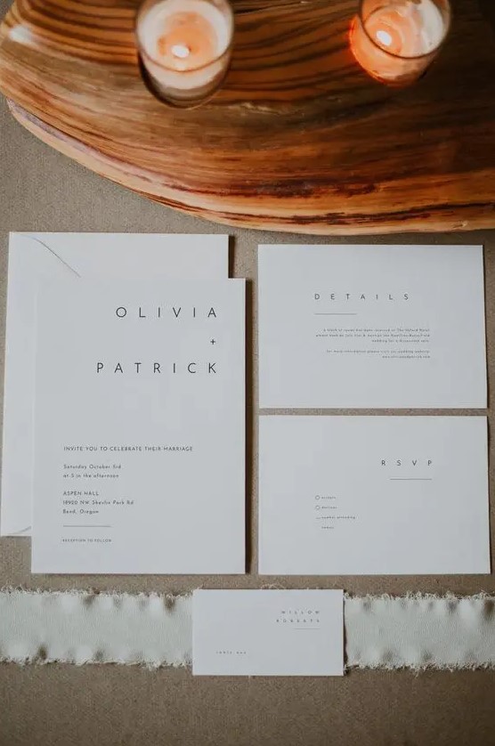 ultra minimalist white wedding invitations with modern black lettering is a stylish solution that will show off your style at once