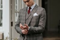 11 a grey plaid three-piece suit, a white shirt, a burgundy bow tie and a brown belt for a touch of vintage