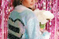 11 a light blue sequin bridal jacket with a heart and some letters is a pretty and glam addition to the look