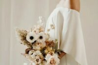 11 a lovely minimalist winter bridal outfit with an off the shoulder plain wedding dress plus a pastel wedding bouquet with grasses