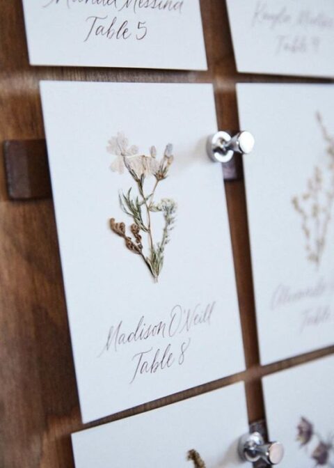 beautiful cards with pressed flowers and calligraphy look delicate and chic and will be a nice idea for a boho wedding