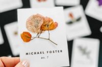 13 beautiful pressed leaf and flower escort cards will charm anyone and will fit a flower-filled, boho or organic wedding