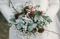 15 a winter wedding bouquet of greenery, baby’s breath, pinecones and twigs plus some ribbon is amagical idea for winter