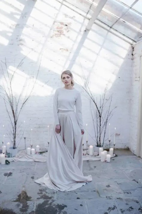 a white cashmere jumper plus an off-white A-line skirt with a train for a minimalist winter bride