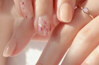 16 nude and coral nails and accented nails with white and pink floral patterns are amazing for a spring or summer wedding