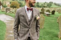 18 a stylish plaid beige three-piece suit, a white shirt with copper buttons, a burgundy bow tie