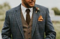 19 a stylish winter groom’s look with a white shirt, a brown plaid waistcoat, a blue plaid blazer, a rust-colored handkerchief and a boutonniere