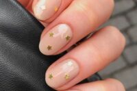20 a nude wedding manicure with gold stars is a stylish and glam idea for a celestial bride