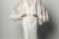 21 a beautiful sheer patterned capelet decorated with fringe is a bold and catchy solution for a fall or winter bride
