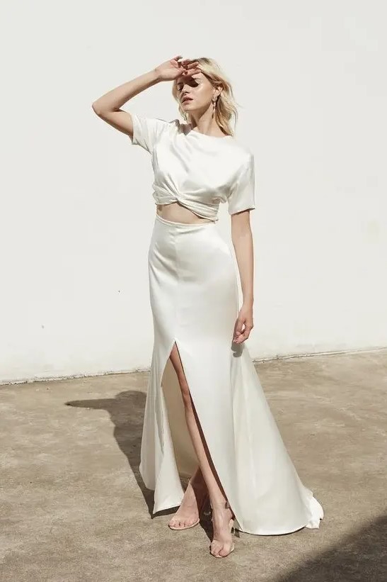 a minimalist bridal separate with a silk crop top with short sleeves and an A line maxi skirt with a front slit