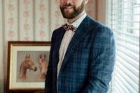 21 a white polka dot shirt, a printed bow tie, a navy plaid blazer, grey pants are a bold and catchy combo for a fall groom