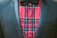 25 a black tuxedo styled with a red plaid shirt and a black silk bow tie looks very unusual and bold, perfect for Christmas