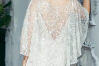 27 a delicate embellished bridal capelet with a cutout back is a fantastic solution for a holiday or just glam bride