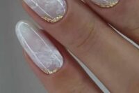 28 a super delicate marble-inspired neutral wedding manicure with gold foil touches is a refined and beautiful idea