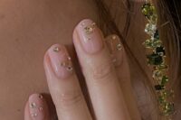 29 a super glam wedding manicure in blush, with large gold rhinestones is amazing for a glam bride