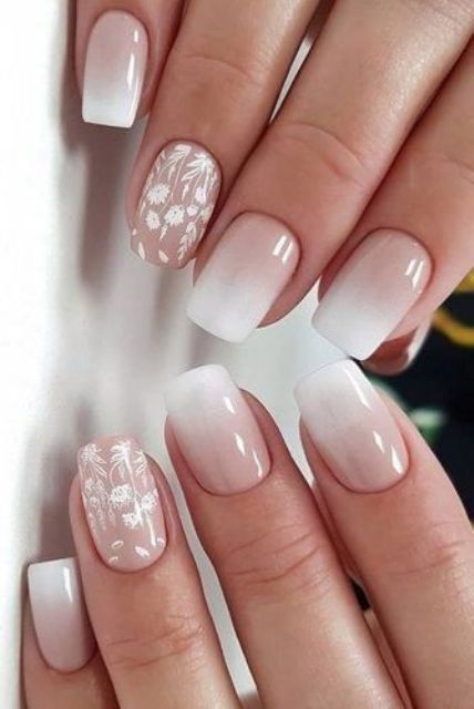 beautiful ombre pink wedding nails and accent ones with white floral designs are a pretty girlish idea for a bride