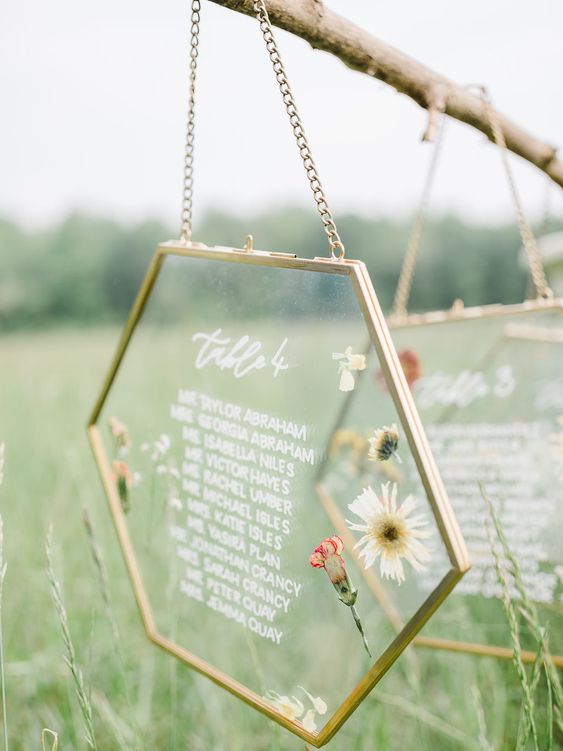 a pressed wildflower hexagon escort card is a gorgeous idea for a wildflower or boho wedding