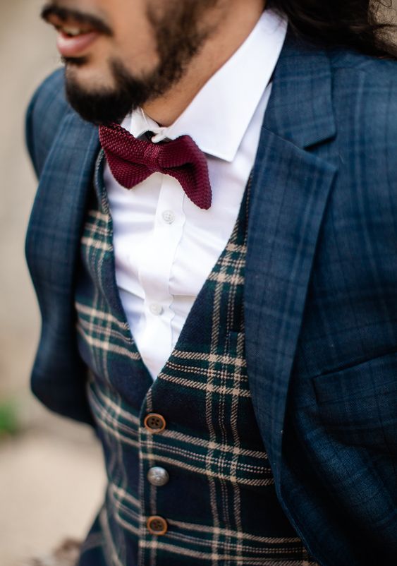a navy plaid pantsuit, a mismatching navy and beige plaid waistcoat, a white shirt and a burgundy bow tie are amazing for winter