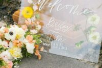 33 a wedding welcome sign with pressed flowers and white calligraphy is amazing for a spring wedding