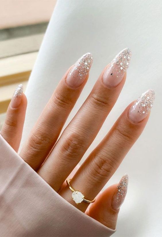 gorgeous long almond blush wedding nails with silver glitter and sparkles are amazing for a glam wedding