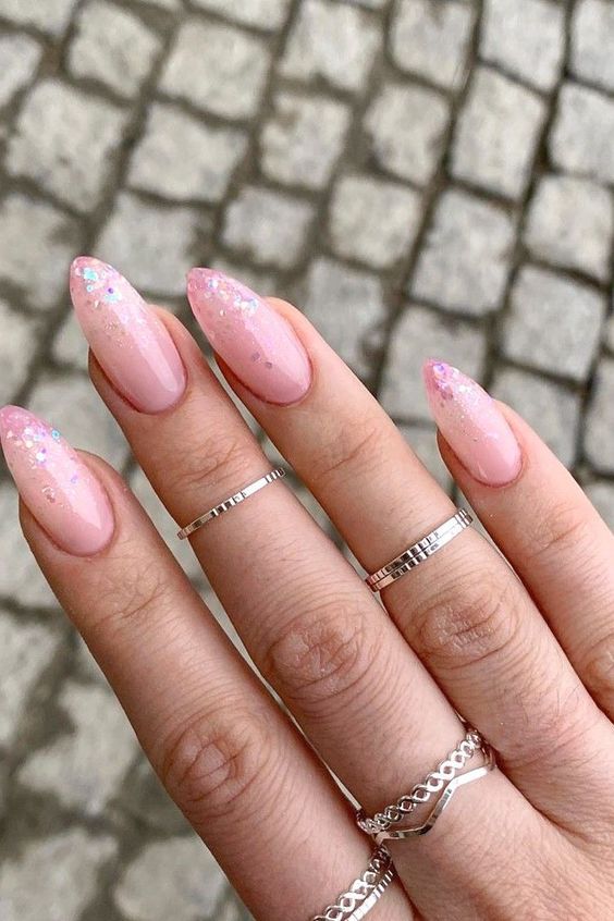 long pink coffin nails with pink and holographic sparkles on the tips is a lovely and pretty bridal idea