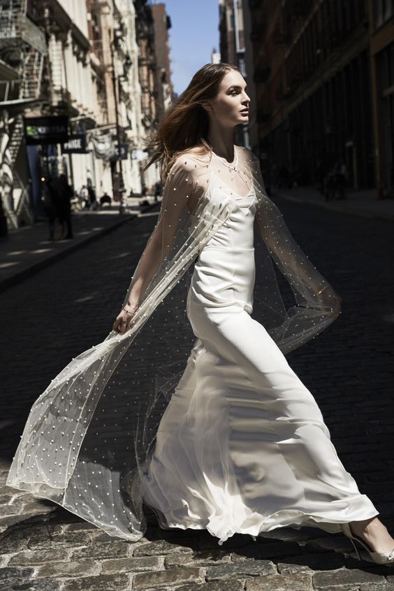 a sheer maxi bridal capelet with pearls is a beautiful solution to pair up with a plain wedding dress