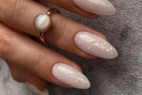 39 nude bridal nails done with pink sparkles look chic, stylish and very romantic and add a glam touch to the look