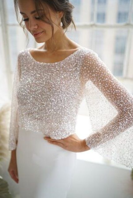 a jaw-dropping silver sequin wedding dress topper with long sleeves and an elegant neckline is a chic glam solution