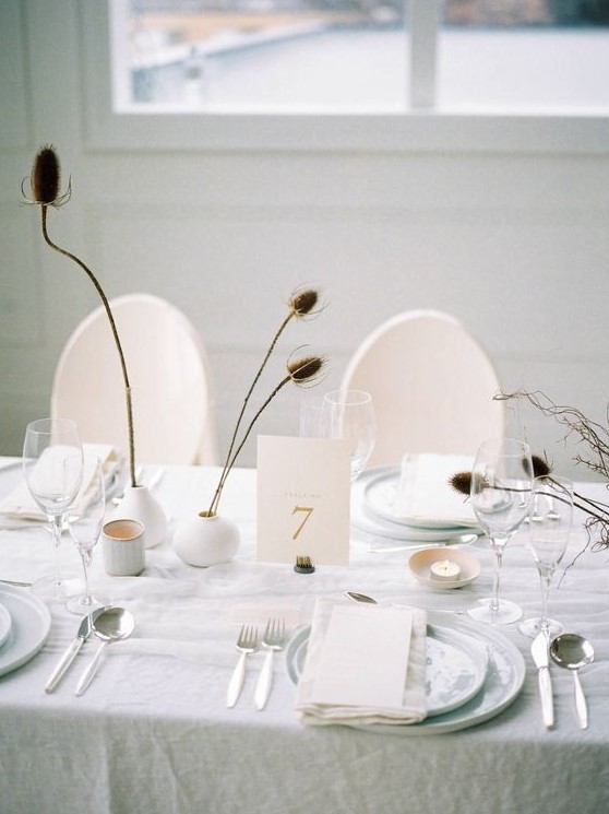 dried flowers in simple matte white vases will be a nice decoration with a subtle winter feel