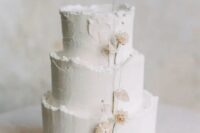 56 a textural white winter wedding cake with a raw edge and dried blooms is a lovely and cool idea that you may rock