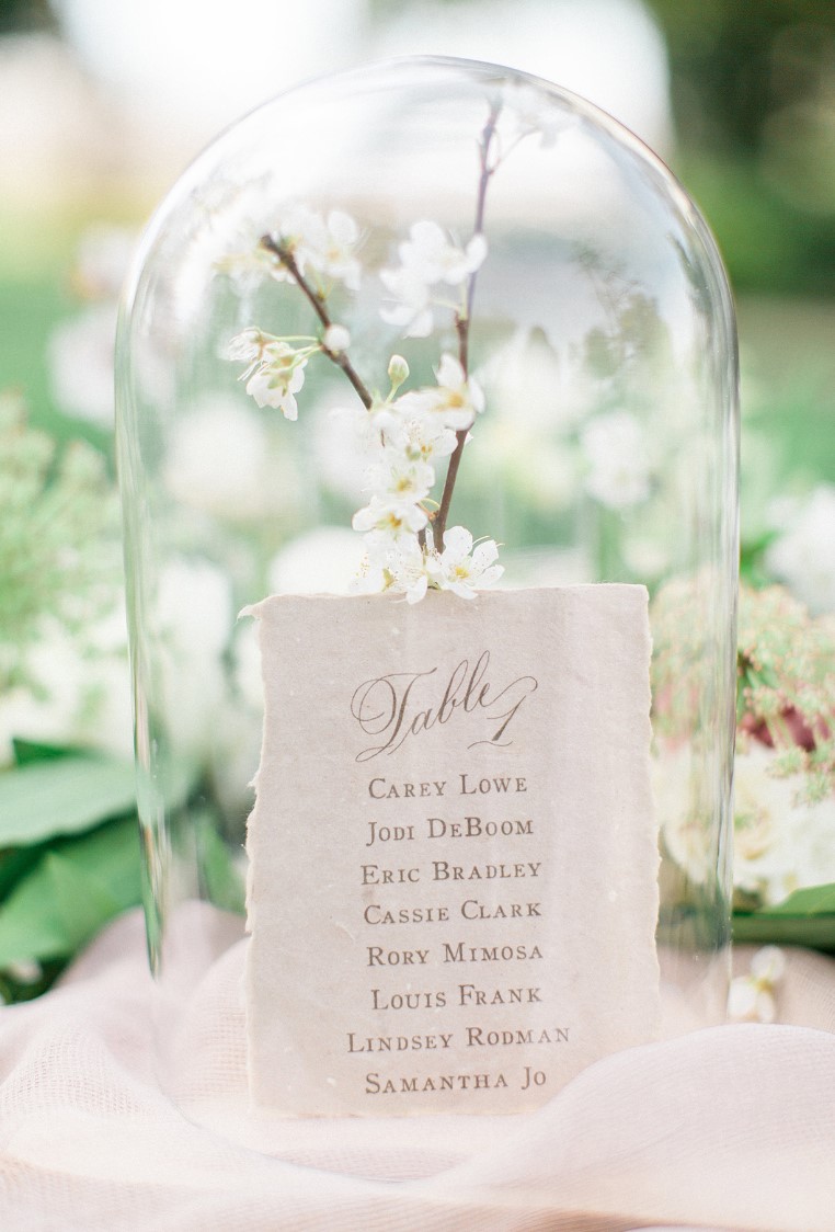 this cloche escort card and branch display stunning and super practical as it won't let wind blow away your card