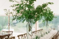 61 tall greenery branches wedding centerpieces, with greenery and white blooms for a natural feel in the space